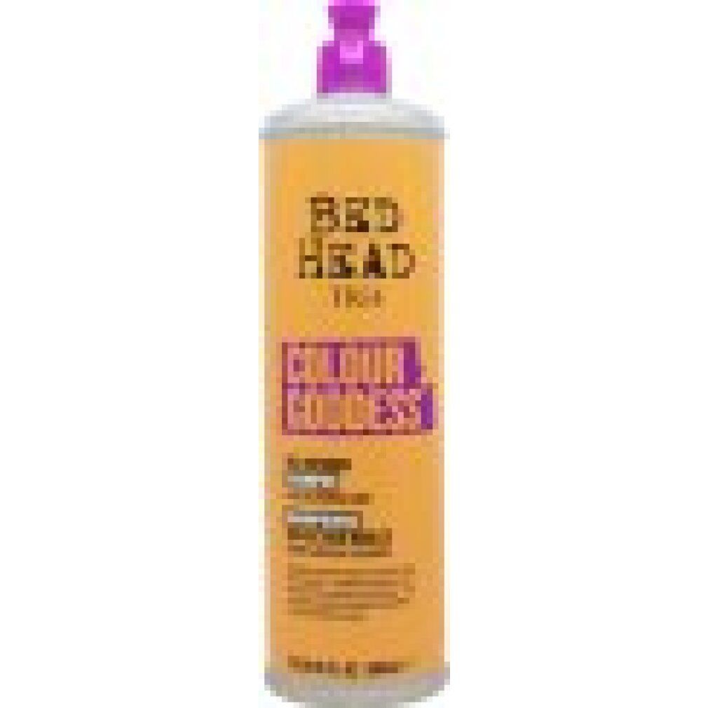 Gelb-orangene Shampoo-Flasche mit lila Verschluss. Aufschrift: Bed Head Tigi Colour Goddess. Öl-Shampoo für coloriertes Haar.