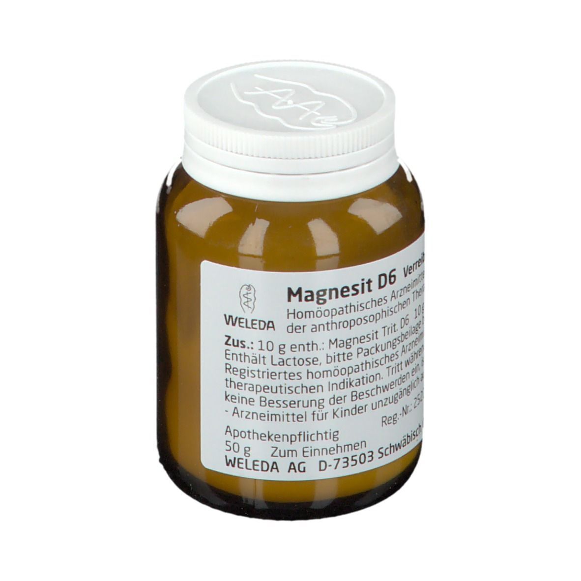 Braune Glasflasche mit weißem Deckel. Etikett mit Text: Magnesit D6 Verreibung, WELEDA. Apothekenpflichtig.