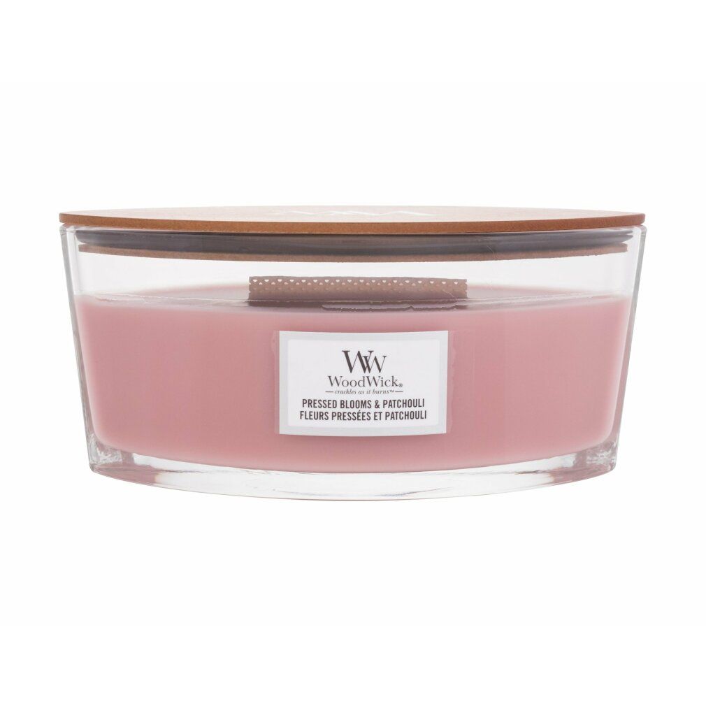 Duftkerze mit Holzdocht. Rosa Wachs in Glasbehälter mit Holzdeckel. Label mit Produktname und Marke WoodWick.