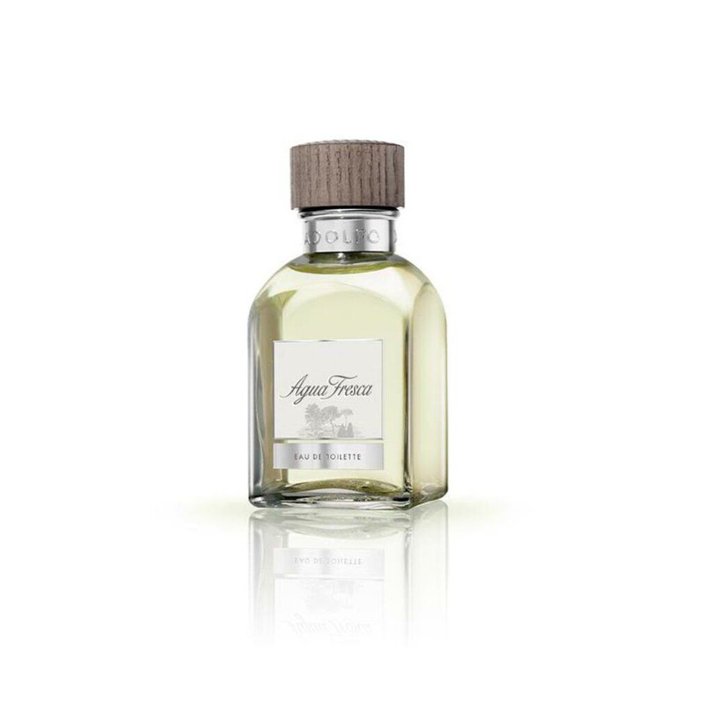 Glasflakon mit Holzverschluss. Aufschrift: Agua Fresca Eau de Toilette. Helle Flüssigkeit. Reflektion auf weißem Hintergrund.