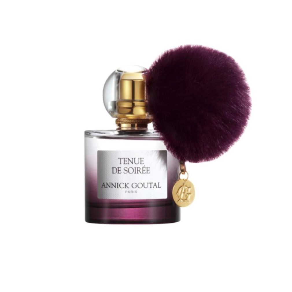 Parfümflakon mit lila Quaste. Aufschrift: Tenue de Soirée, Annick Goutal Paris. Goldfarbener Verschluss.