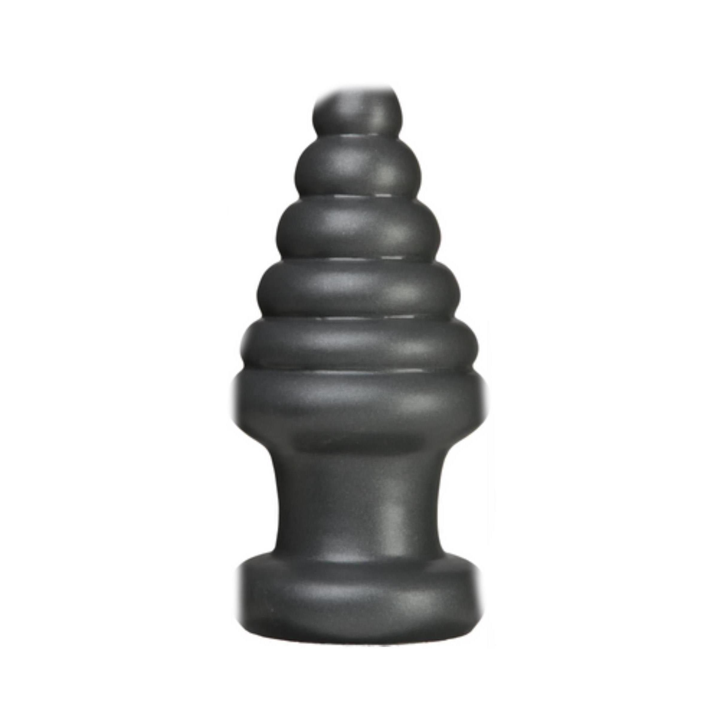 Schwarzer Analplug. Mehrteilige Form, konisch zulaufend. Basis mit breiterem Durchmesser.