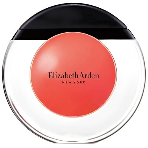 Runder Behälter mit schwarzem Deckel. Roter Inhalt mit Elizabeth Arden-Logo. Klarer, runder Behälter.