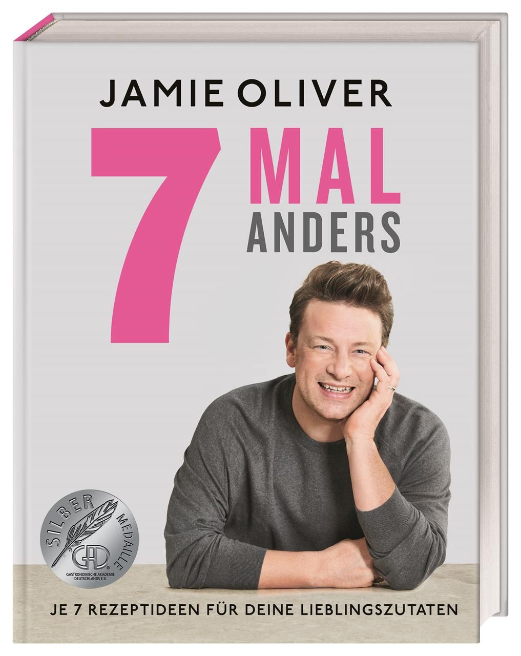 Buchcover mit Jamie Oliver und Titel "7 Mal Anders". Silbermedaille. Text: "Je 7 Rezeptideen für deine Lieblingszutaten".