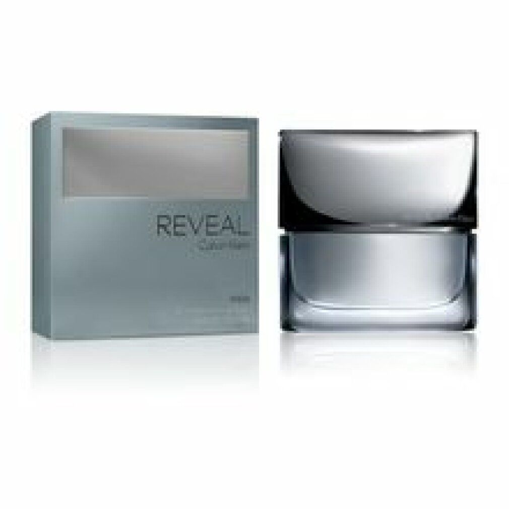 Reveal Calvin Klein Men Flakon und Verpackung. Rechteckiger Flakon mit silbernem Deckel. Graue Verpackung mit Schriftzug Reveal.