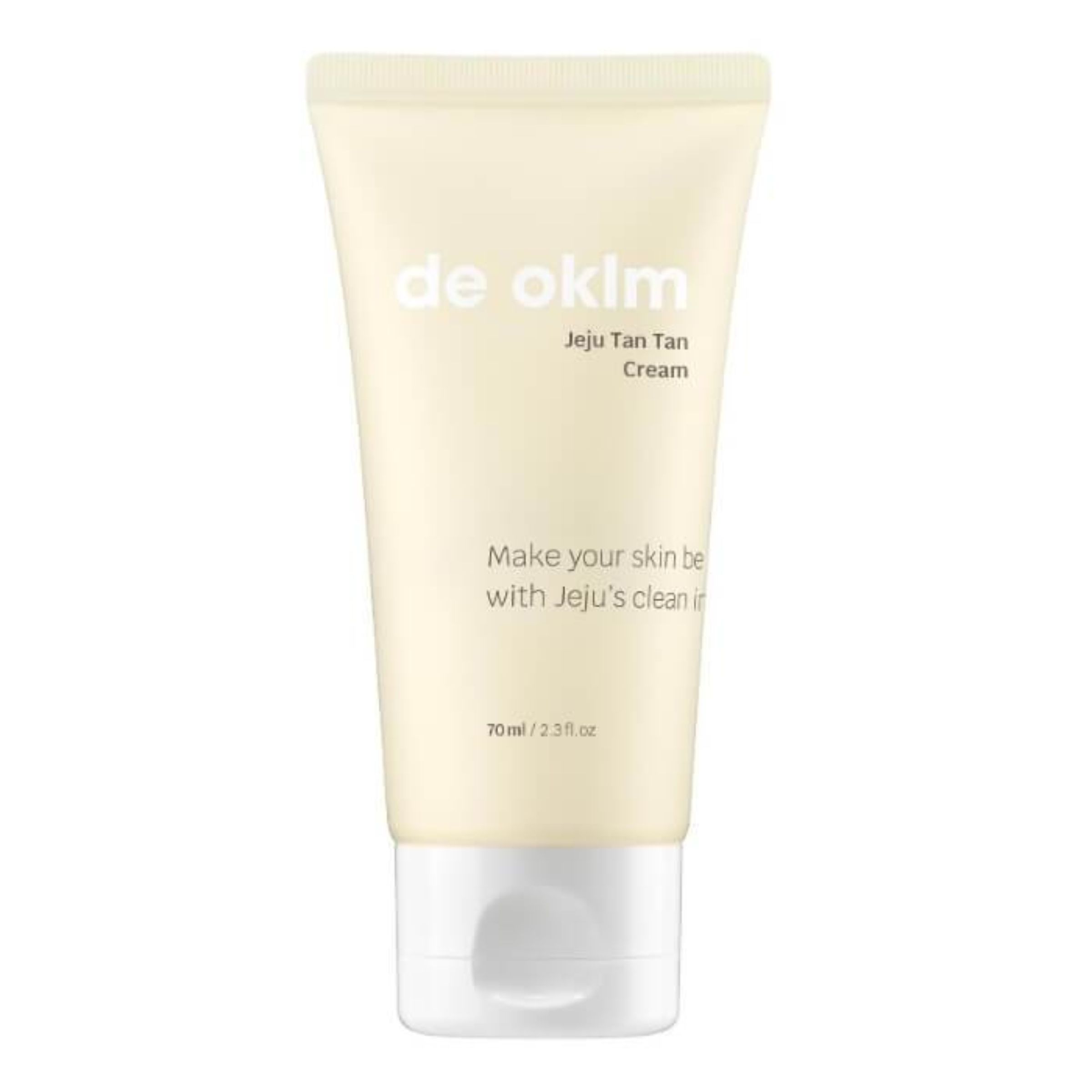 Creme-Tube mit Produktnamen und Text. Beige Tube mit weißem Deckel. Aufschrift: de oklm, Jeju Tan Tan Cream.