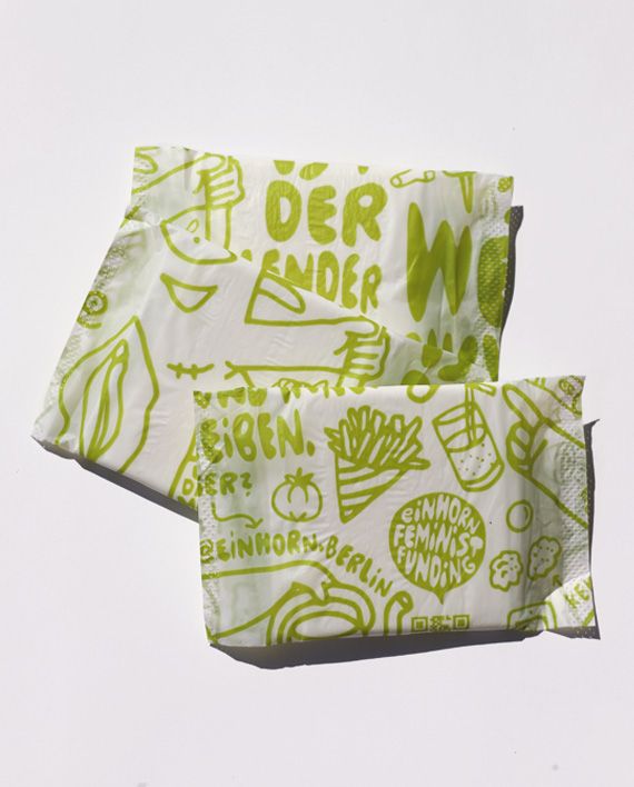 Zwei einzeln verpackte Pads. Grün bedruckt mit Zeichnungen und Text. Marke: einhorn.