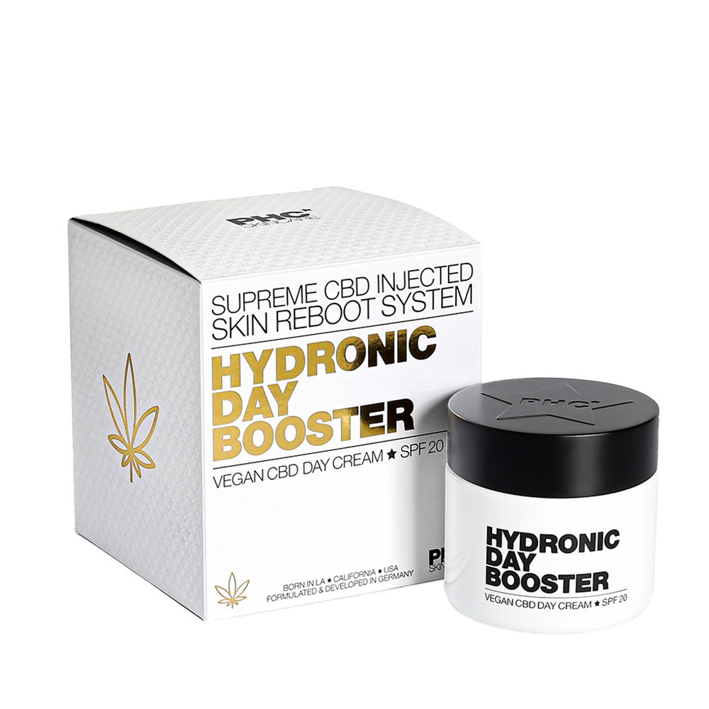 Weißer Karton und Tiegel mit Aufschrift: HYDRONIC DAY BOOSTER, Vegan CBD Day Cream + SPF 20. Goldene Blätter-Grafik.