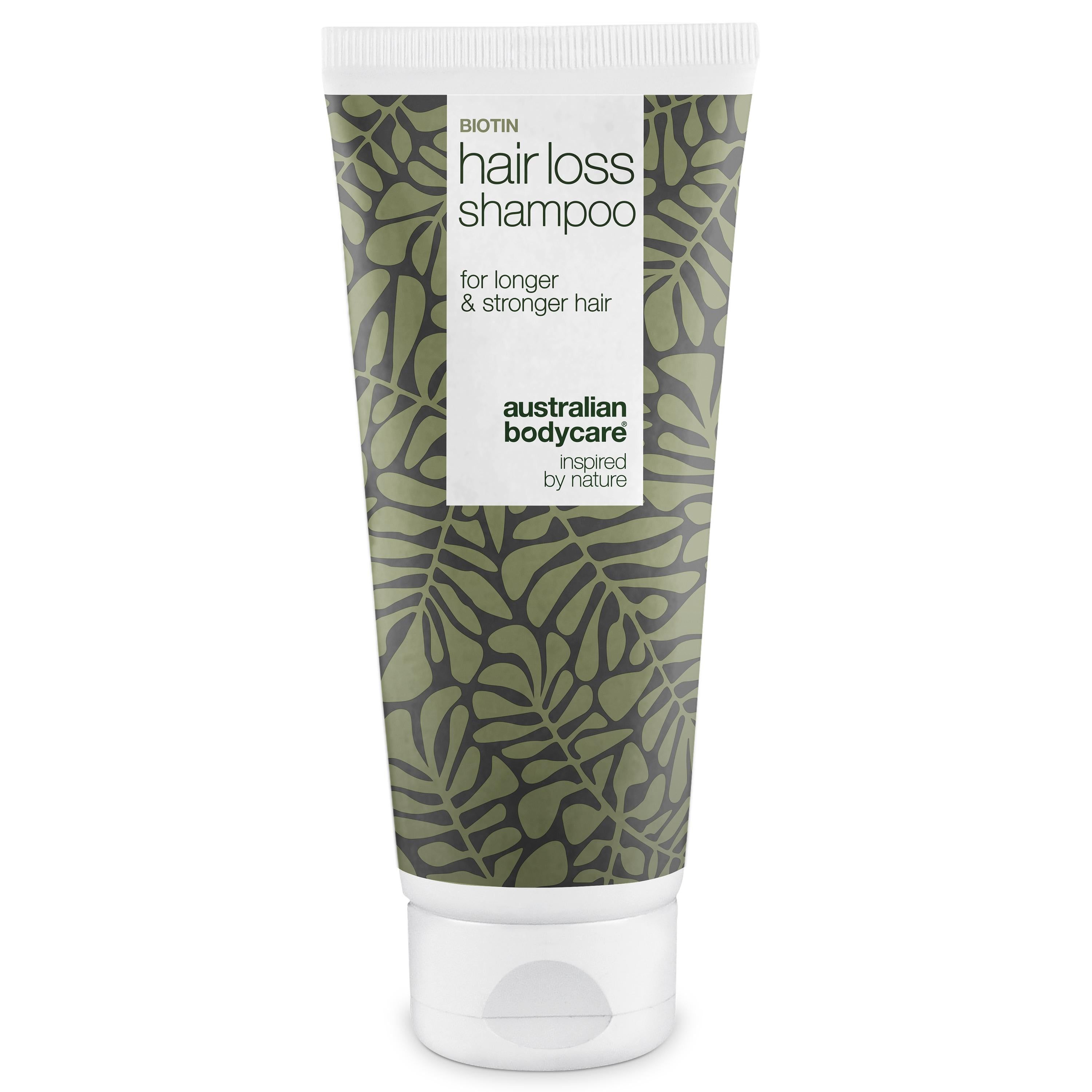 Biotin Hair Loss Shampoo. Tube mit grünem Blattmuster. Text: for longer & stronger hair. Australian Bodycare.