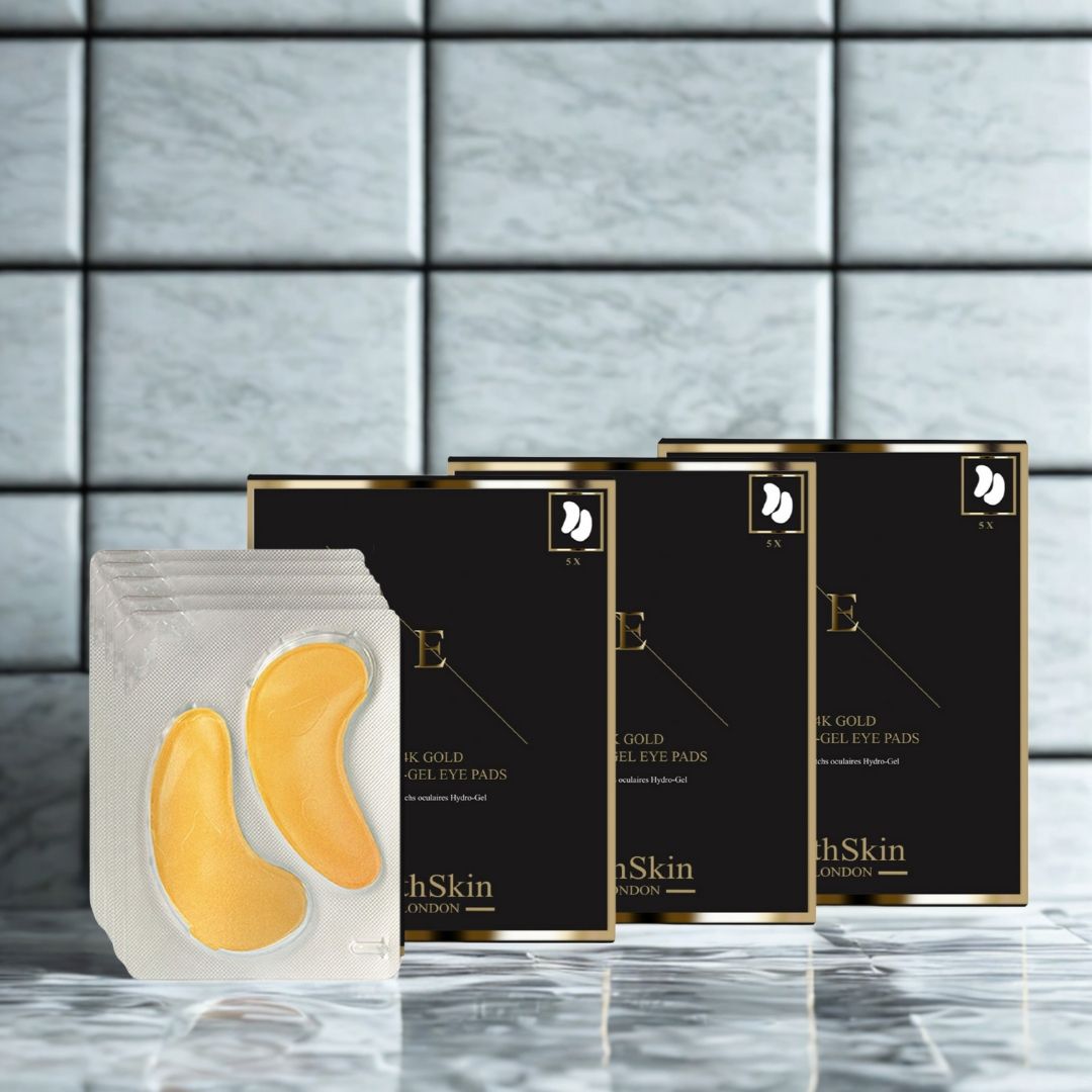 Packung mit Augenpads und drei Schachteln. Die Pads sind goldfarben. Auf den Schachteln steht "ErthSkin London".