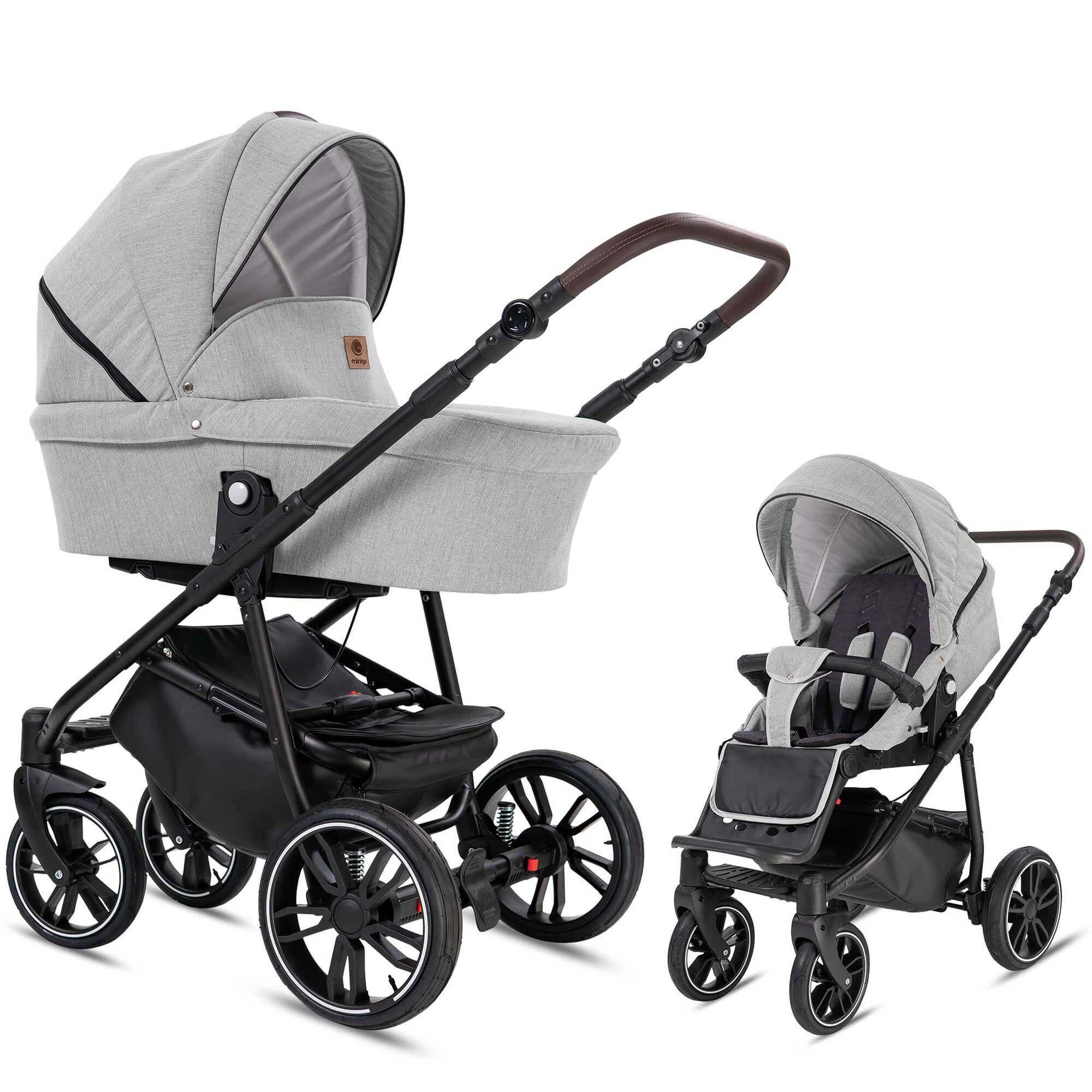 Kombikinderwagen, grau. Gestell schwarz, Räder schwarz-weiß. Zwei Aufsätze: Babywanne und Sportsitz. Griff braun.