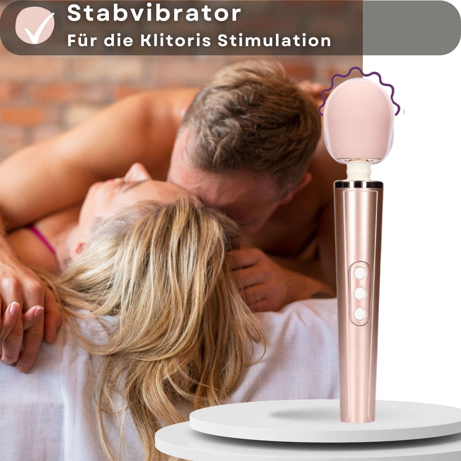 Stabvibrator. Rosa Kopf, goldfarbener Griff. Paar im Hintergrund. Für Klitoris-Stimulation.