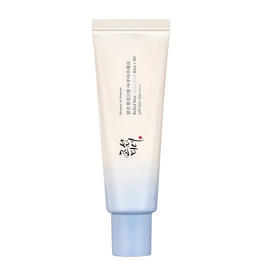 Tube Sonnenschutzmittel mit Reis und Panthenol-Symbolen.