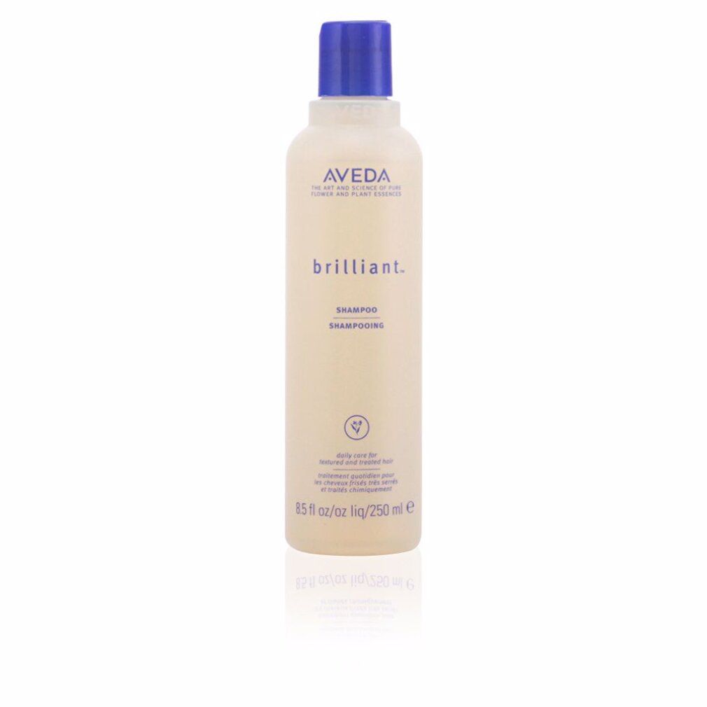 Beige Shampoo-Flasche mit blauem Deckel. Aufschrift: Aveda, brilliant. Shampoo. 250 ml. Vegan-Logo.