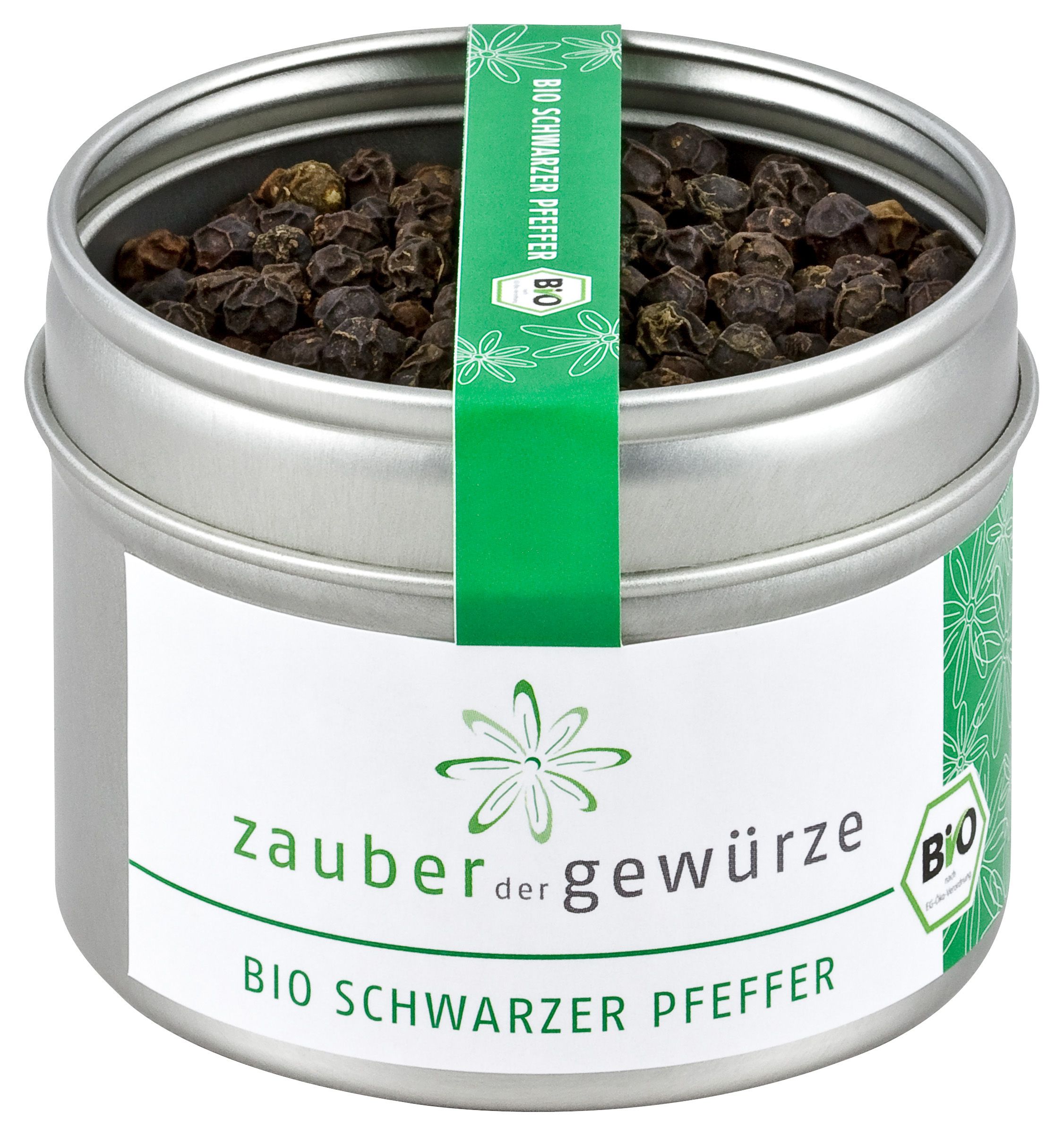 Dose mit Bio Schwarzem Pfeffer. Silberne Dose mit Etikett und grünem Band. Aufschrift: Zauber der Gewürze, Bio Schwarzer Pfeffer.