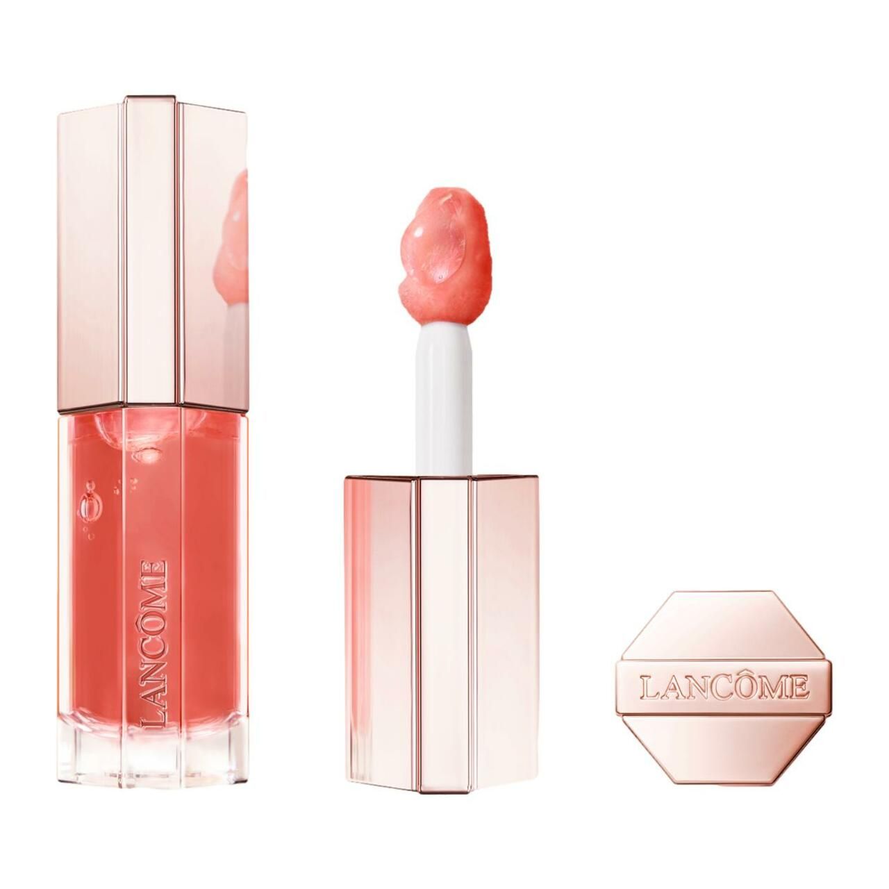Drei Lancôme Juicy Tubes Lipgloss. Roségoldene Verpackung. Applikator sichtbar. Marke Lancôme.