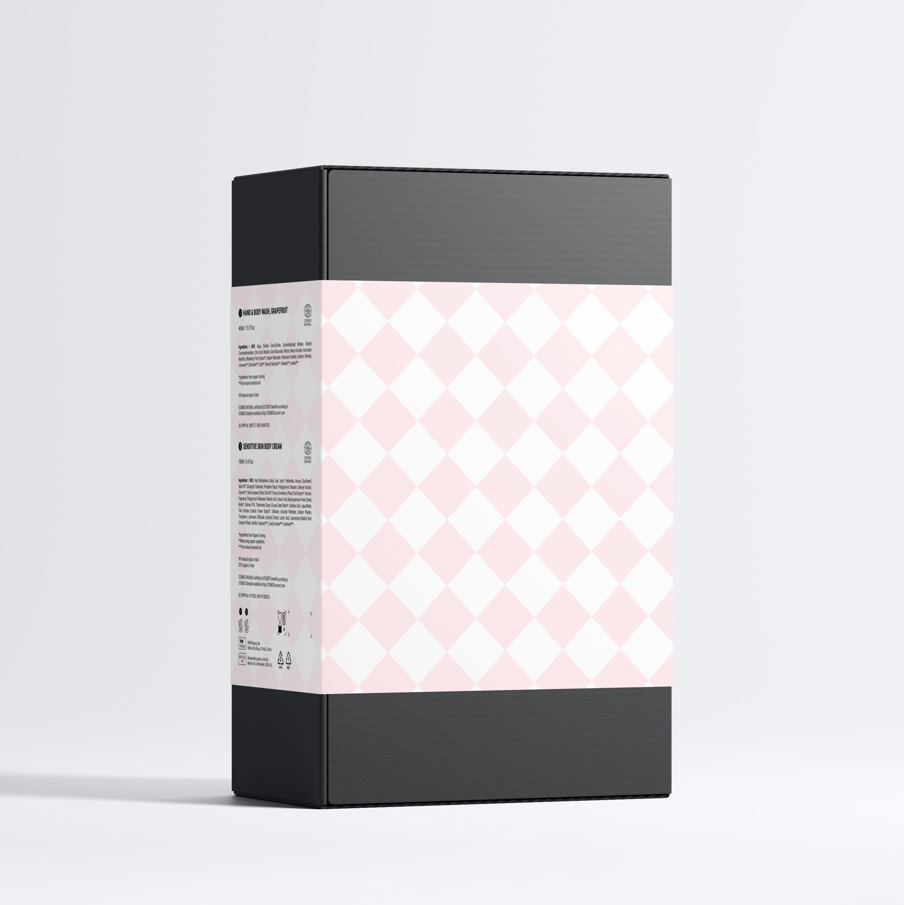 Schwarze Geschenkbox mit rosa Rautenmuster. Enthält Produktinformationen auf einem weißen Etikett.
