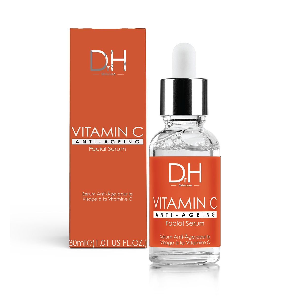 Produktflasche und Verpackung. Flasche mit silbernem Deckel und Pipette. Orangefarbene Verpackung mit Text: Vitamin C Anti-Ageing.