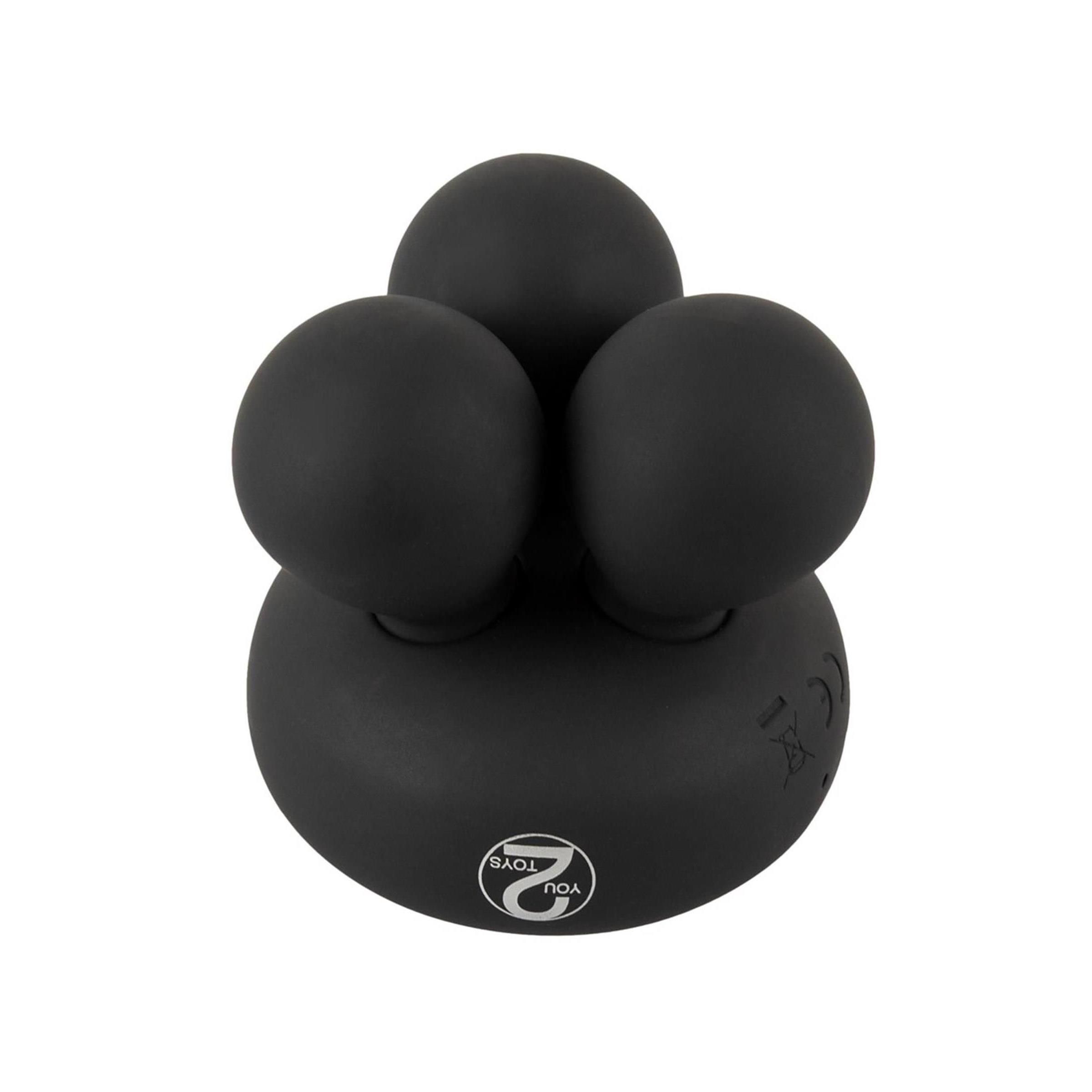 Schwarzes Massagegerät mit drei kugelförmigen Füßen. Logo mit der Zahl 2.