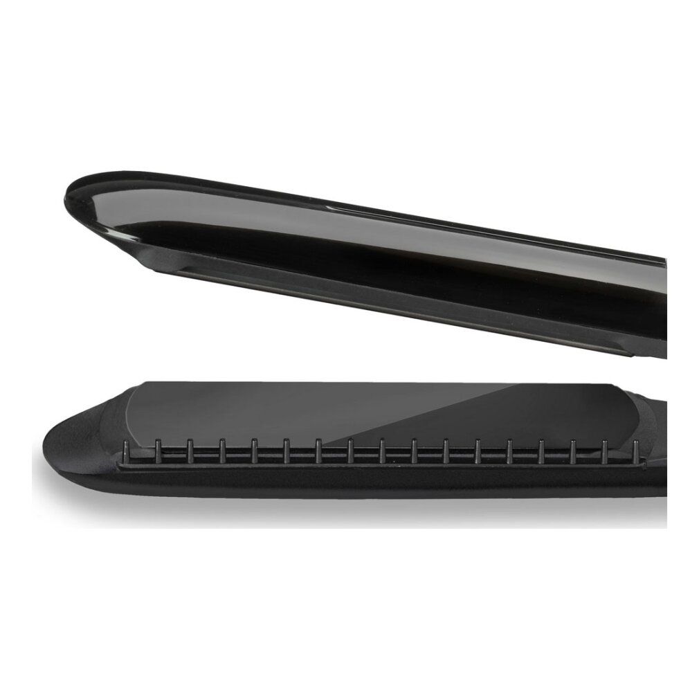 Nahaufnahme des Haarglätters. Schwarze Platten, abgerundete Spitze. Detailansicht.