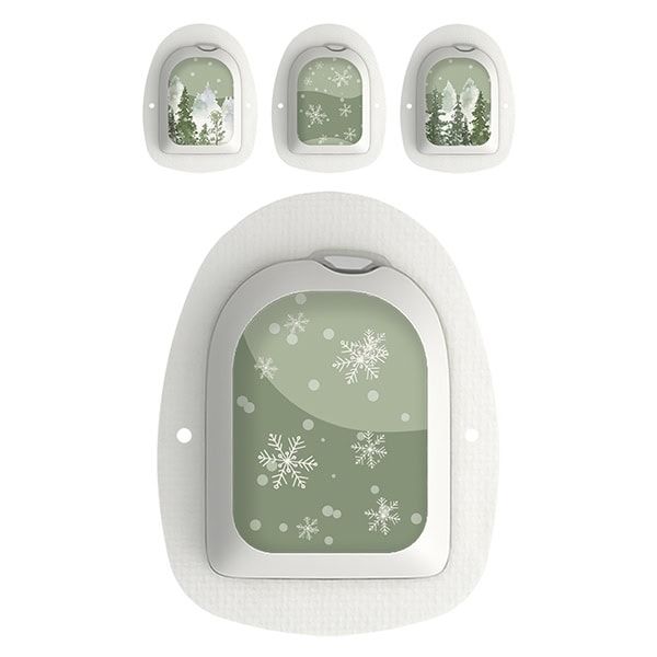 Omnipod-Geräte mit "Magic of Winter"-Aufklebern. Winterlandschaft und Schneeflocken. Weiße Geräte.