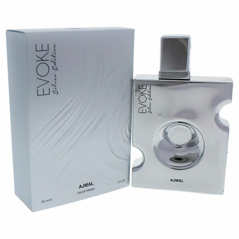 Silberne Flasche und Verpackung. Auf der Verpackung steht 'EVOKE Silver Edition' und 'AJMAL'. Auf der Flasche steht ebenfalls 'EVOKE'.