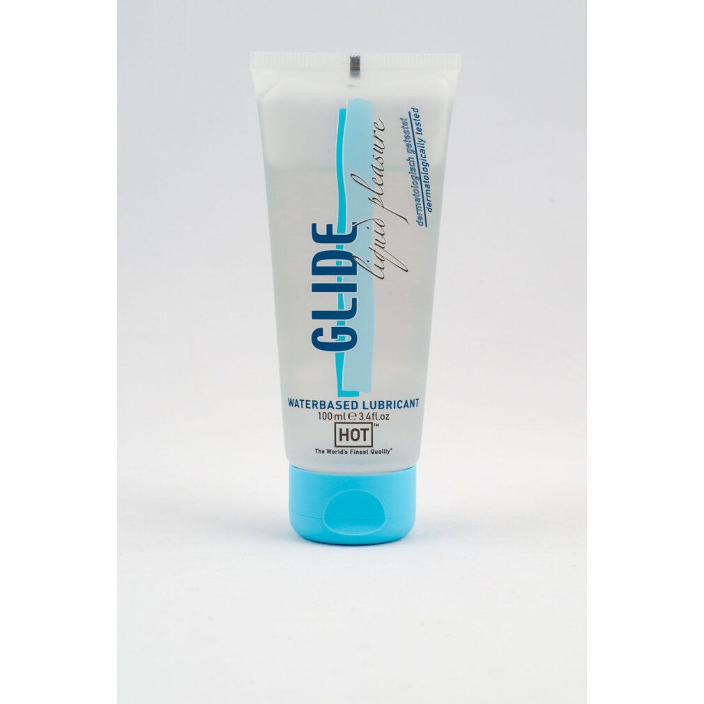 Transparente Tube mit blauer Schrift. Aufschrift: GLIDE liquid pleasure, WATERBASED LUBRICANT, HOT. Dermatologisch getestet.