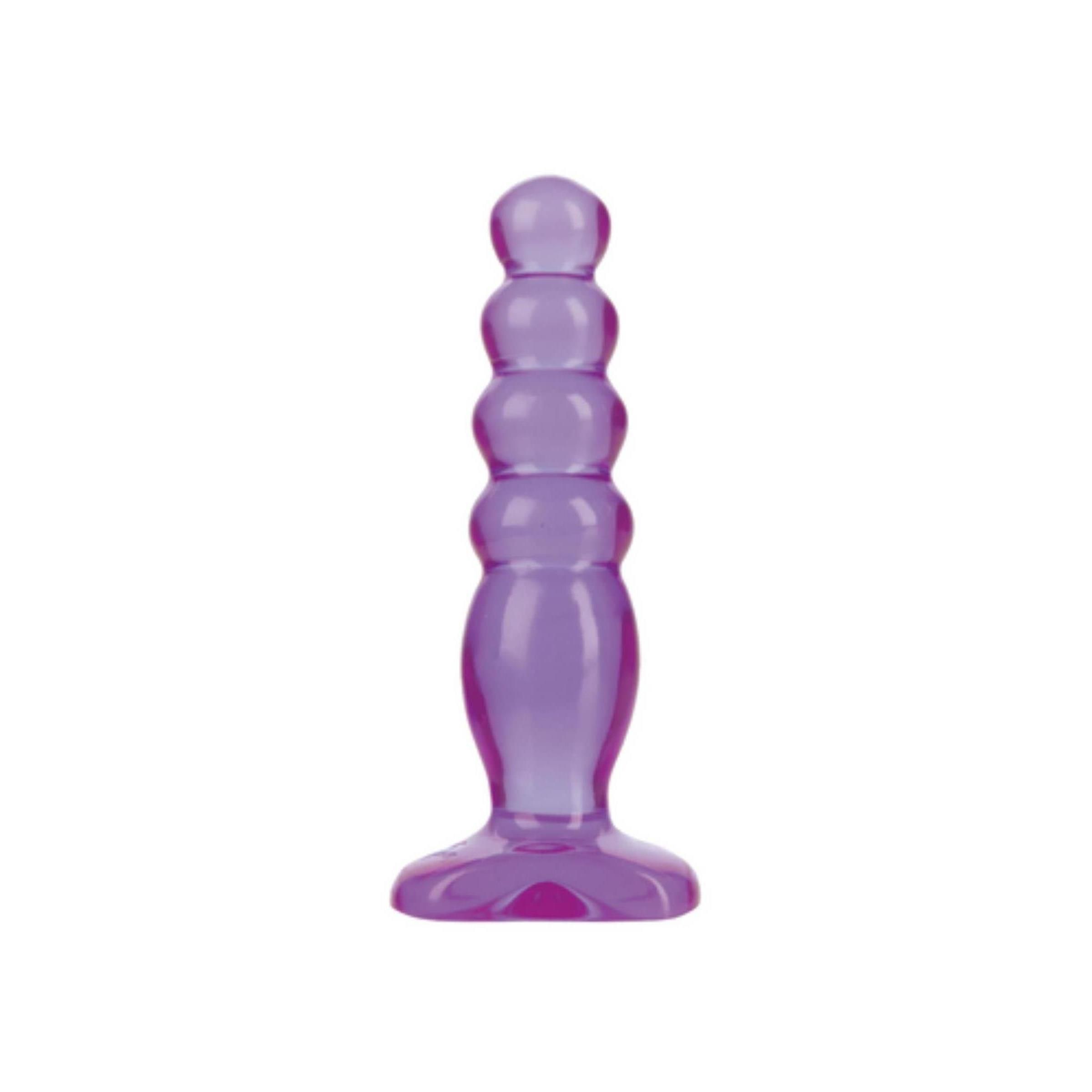 Lila Anal-Plug. Geriffelte Form mit abgerundeter Spitze und Basis.