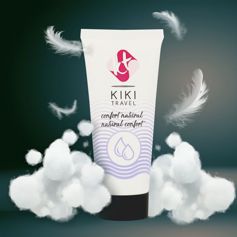 Tube Gleitgel mit Federn und Watte. Aufschrift: KIKI TRAVEL, confort natural. Weiße Tube mit lila Akzenten und schwarzem Verschluss.