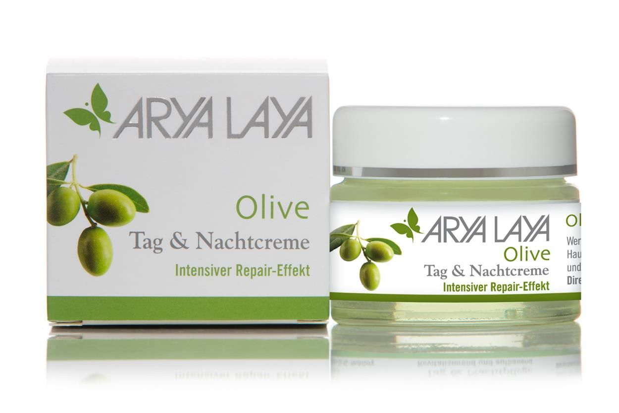 Creme-Tiegel und Schachtel. Aufschrift: ARYA LAYA Olive Tag & Nachtcreme. Abbildung von Oliven und Blättern.