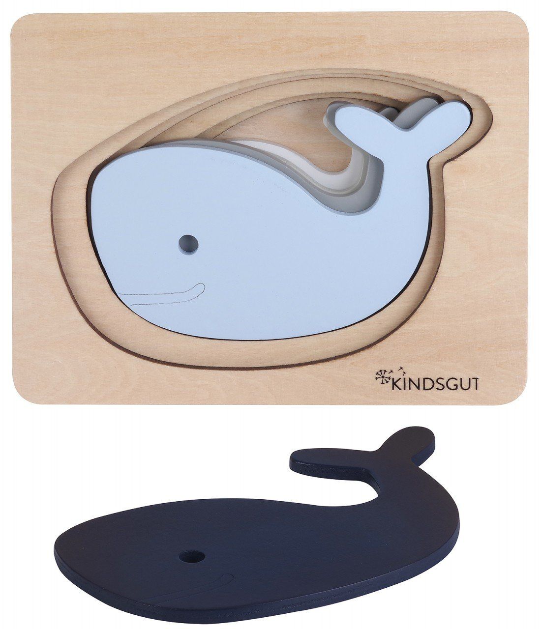 Kindsgut Wal-Puzzle mit Wal-Puzzleteilen. Mehrere Wal-Puzzleteile liegen neben dem Puzzle. Holz, blau und grau.