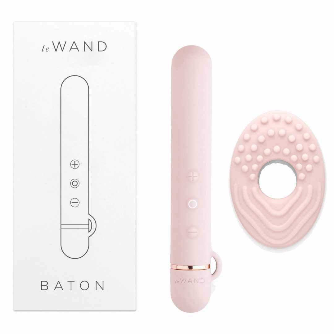 Rosa Stab-Vibrator, Ring-Aufsatz und Verpackung. Auf der Verpackung steht 'Le Wand' und 'Baton'.