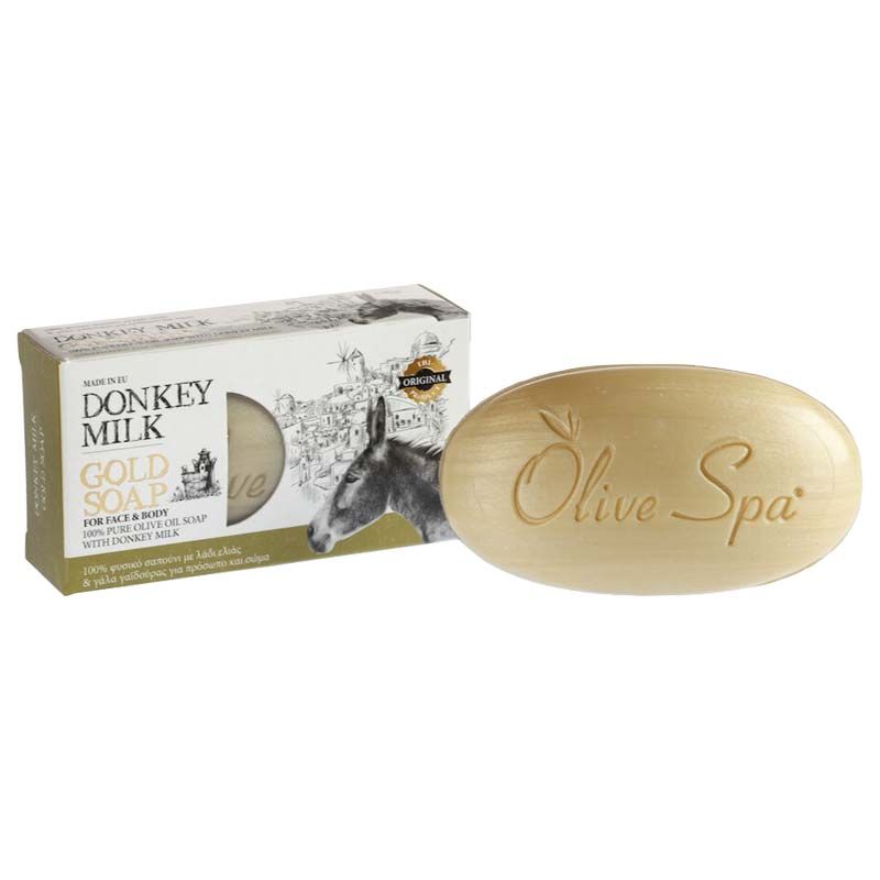Oval geformte Seife mit der Aufschrift "Olive Spa". Daneben eine Schachtel mit der Aufschrift "Donkey Milk Gold Soap".
