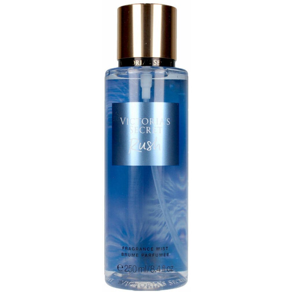 Victoria's Secret Rush Fragrance Mist. Blaue Flüssigkeit in einer zylindrischen Flasche. Goldfarbener Deckel. Produktname auf Etikett.
