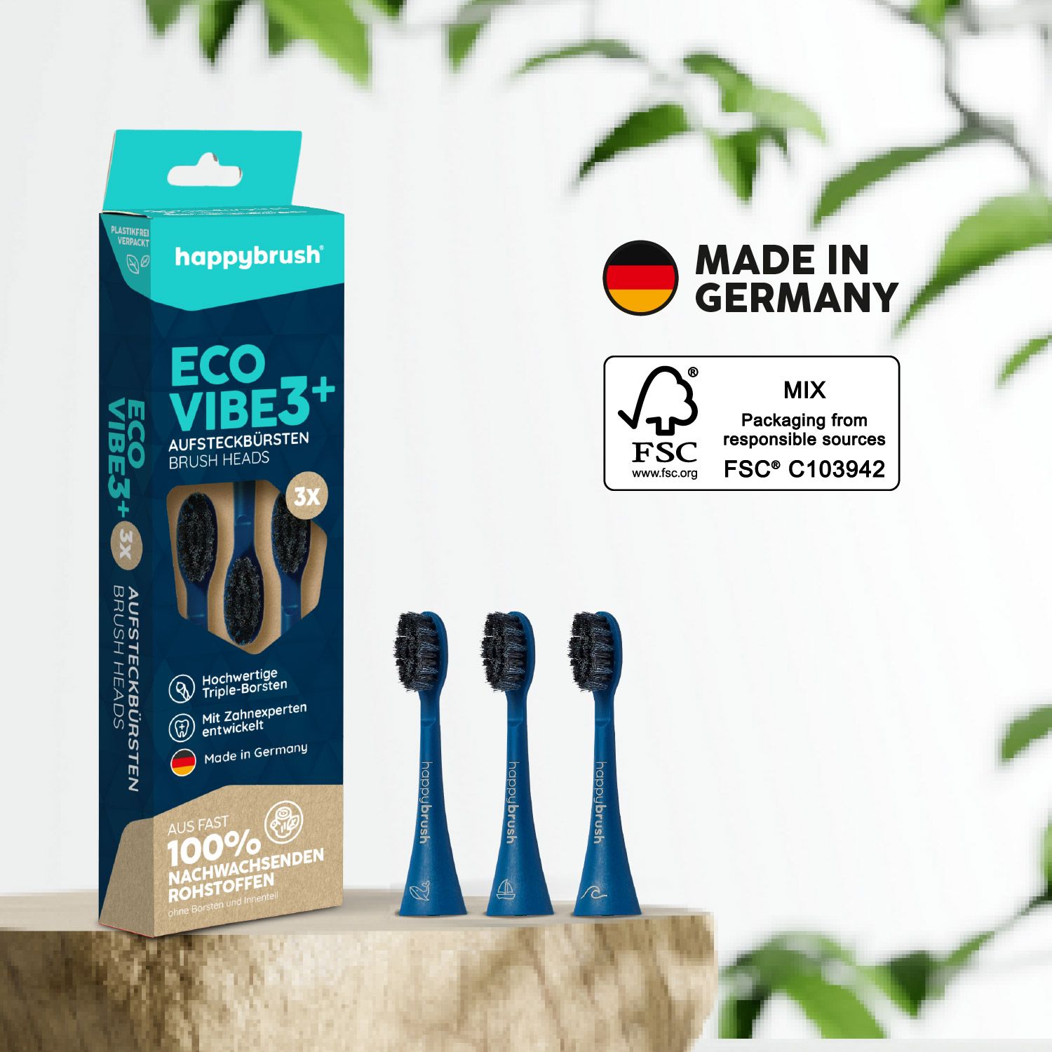 Zahnbürstenköpfe und Verpackung. Blaue Griffe, schwarze Borsten. Verpackung mit Produktnamen, Logos und FSC-Zertifizierung.