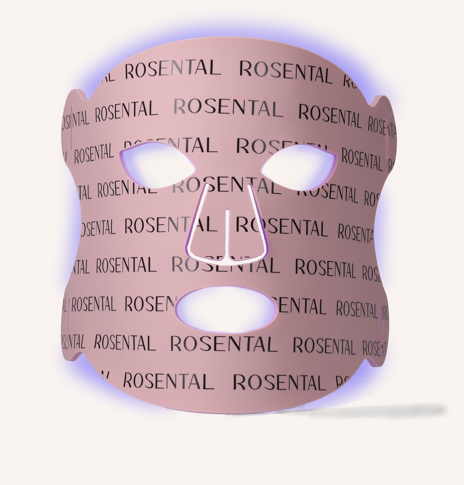 Rosa LED-Gesichtsmaske mit Aussparungen für Augen, Nase und Mund. Der Schriftzug ROSENTAL ist wiederholt aufgedruckt. Blaue Lichteffekt.