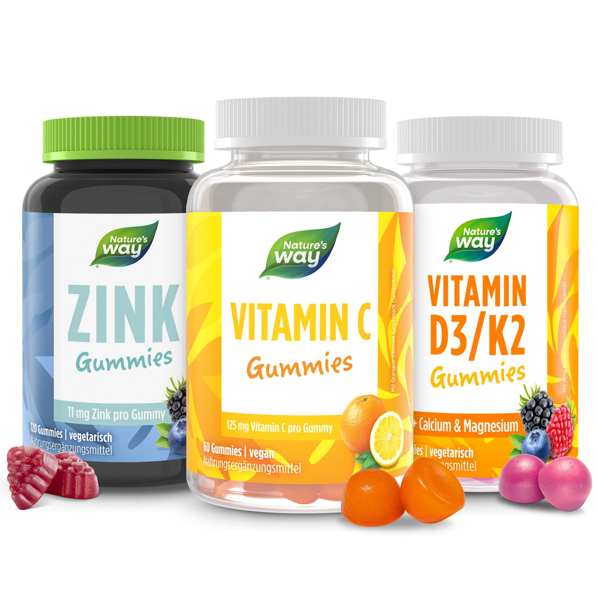 Drei Flaschen mit Vitamin-Gummis. Zink, Vitamin C und Vitamin D3/K2. Jede Flasche hat ein Etikett mit Produktinformationen und der Marke Nature's Way.