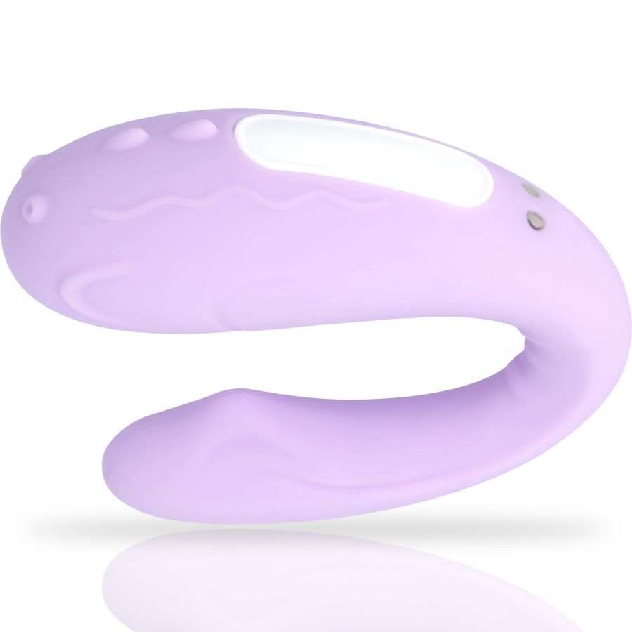 Lila Vibrator mit geschwungener Form. Oberseite mit wellenförmigen Details und weißem Bereich. Zwei Knöpfe.
