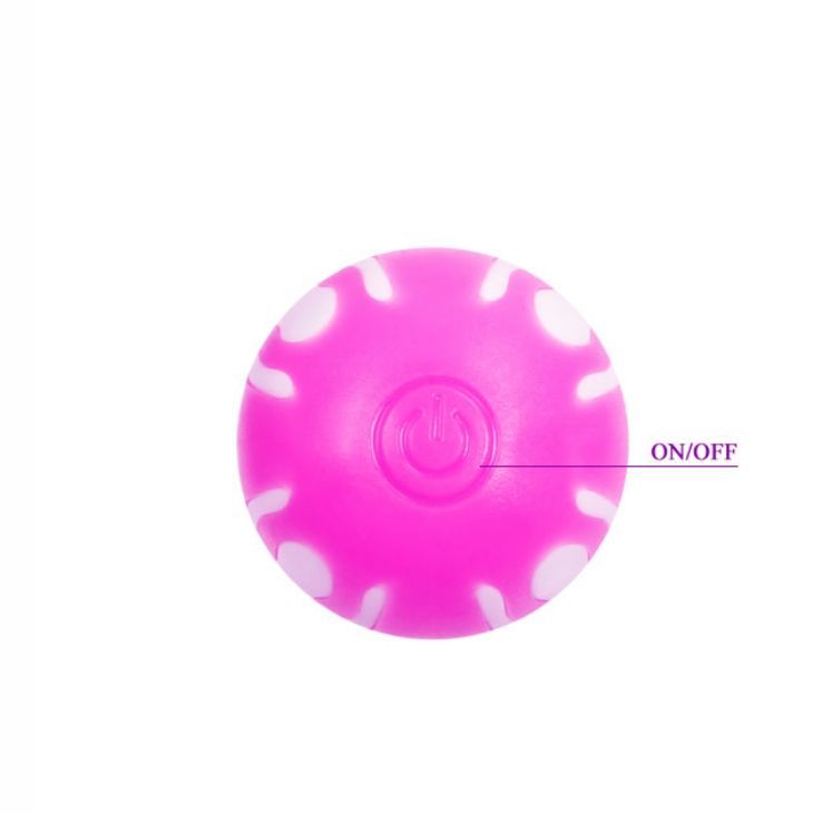 Runder, pinkfarbener Knopf mit weißem Muster und Ein-/Aus-Schalter. Aufschrift 'ON/OFF'.