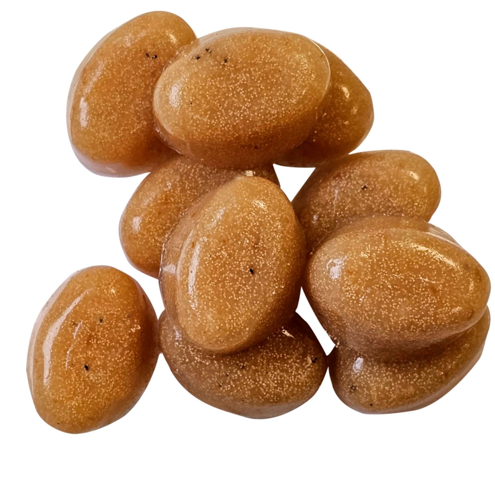 Haufen von ovalen, bernsteinfarbenen Gel-o-Drops. Einzelne Tropfen mit sichtbarer Textur.