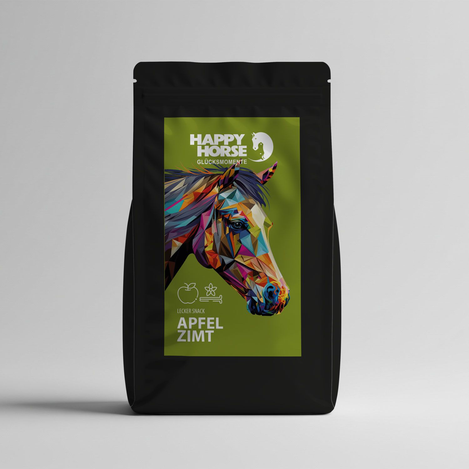 Schwarze Verpackung mit grünem Etikett. Auf dem Etikett: buntes Pferdeportrait, Apfel, Zimt, und "Happy Horse".