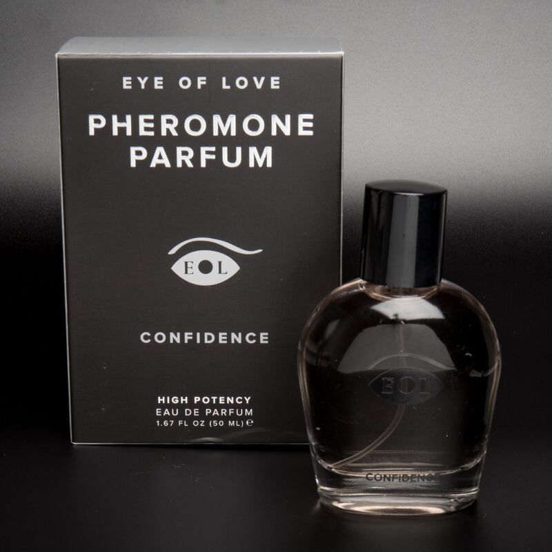 Parfümflakon mit schwarzem Verschluss neben einer schwarzen Box mit "EYE OF LOVE" Schriftzug.