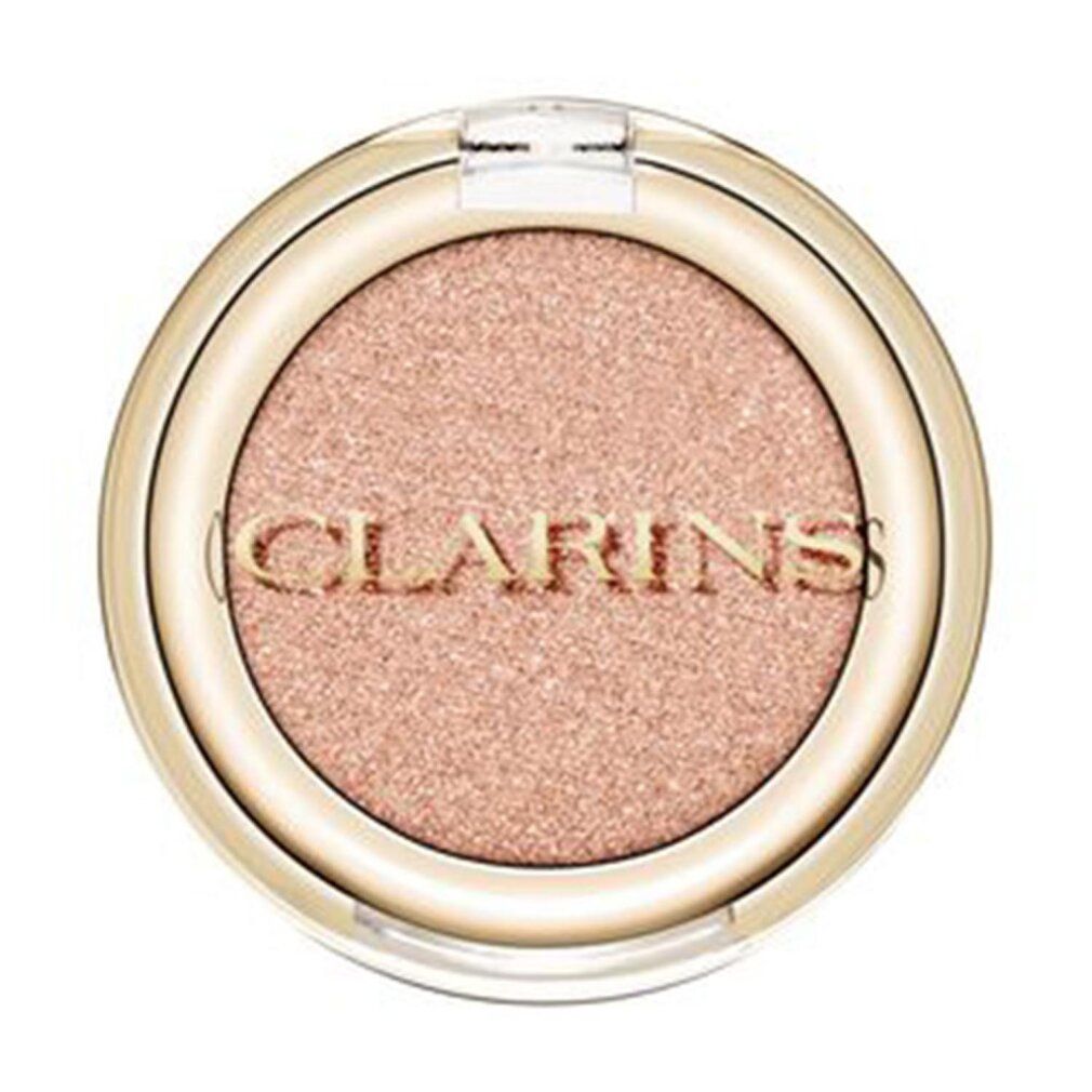 Runder Lidschattenbehälter mit goldfarbenem Rand und durchsichtigem Deckel. Auf dem Lidschatten steht "CLARINS".
