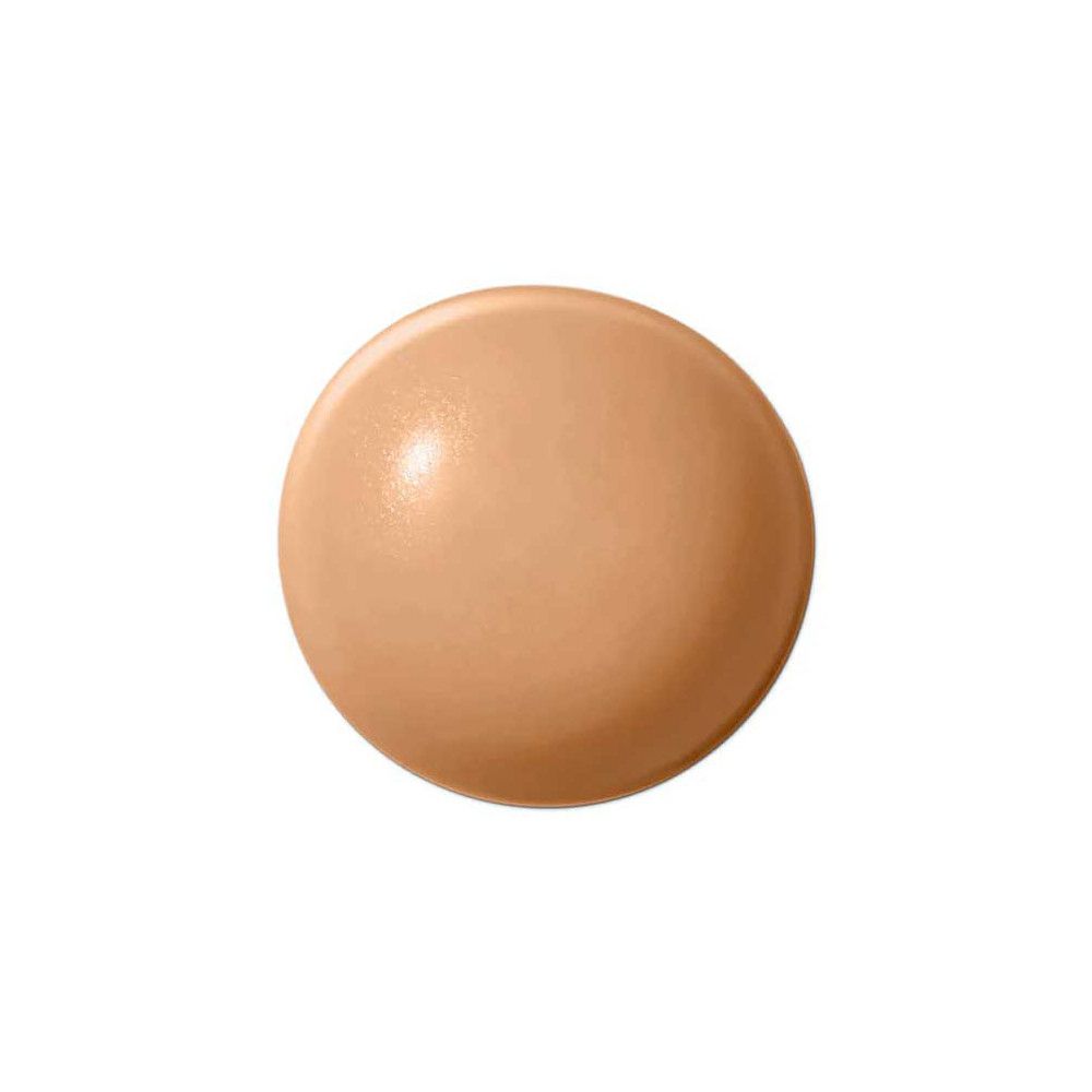 Runder, beigefarbener Concealer-Farbton. Keine Beschriftung sichtbar.
