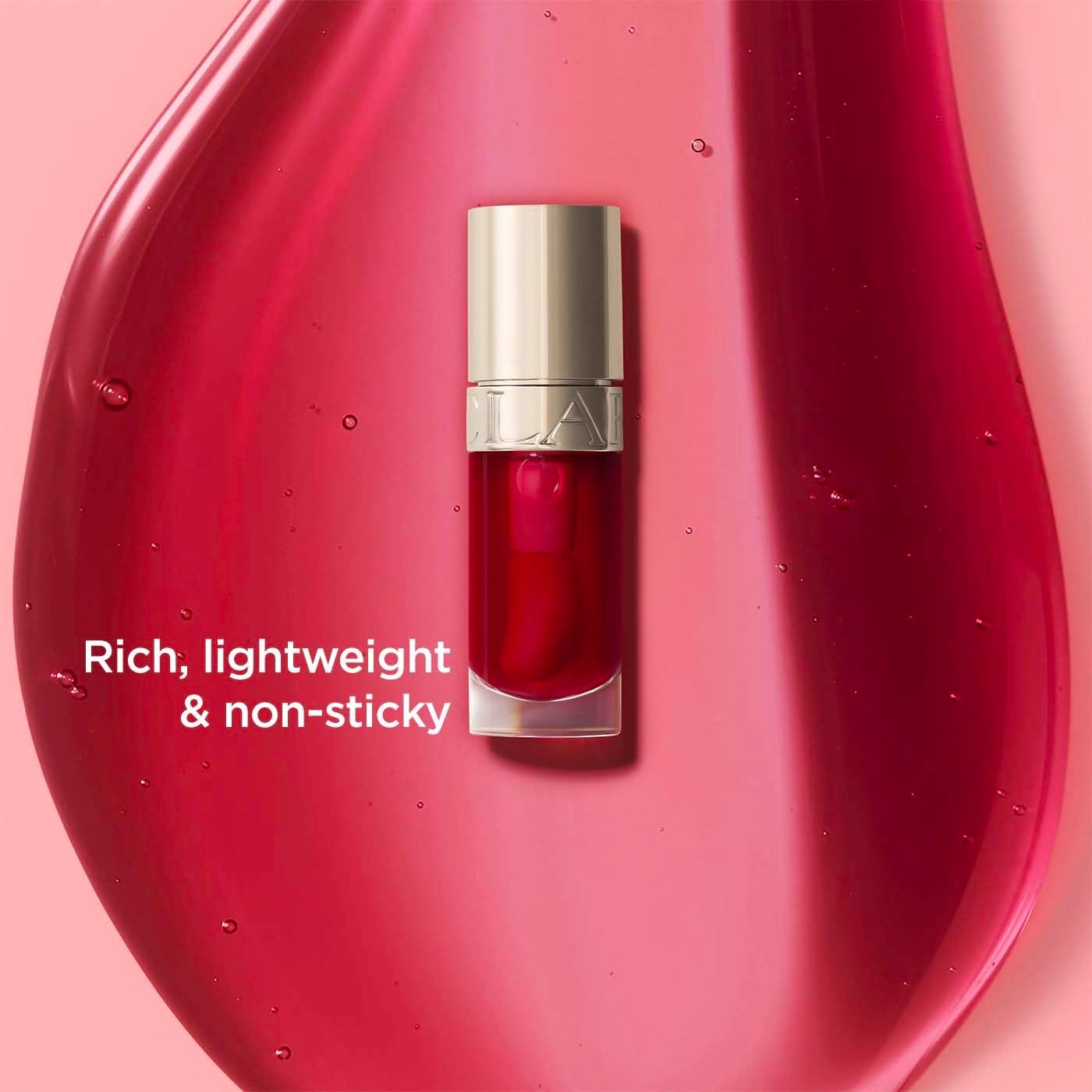Flakon Lippenöl. Rote Flüssigkeit. Goldfarbener Deckel. Text: Rich, lightweight & non-sticky.