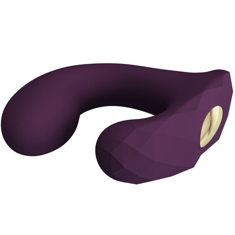 Lila Vibrator mit U-Form. Geometrische Oberfläche, abgerundete Enden. Goldfarbene Öffnung.
