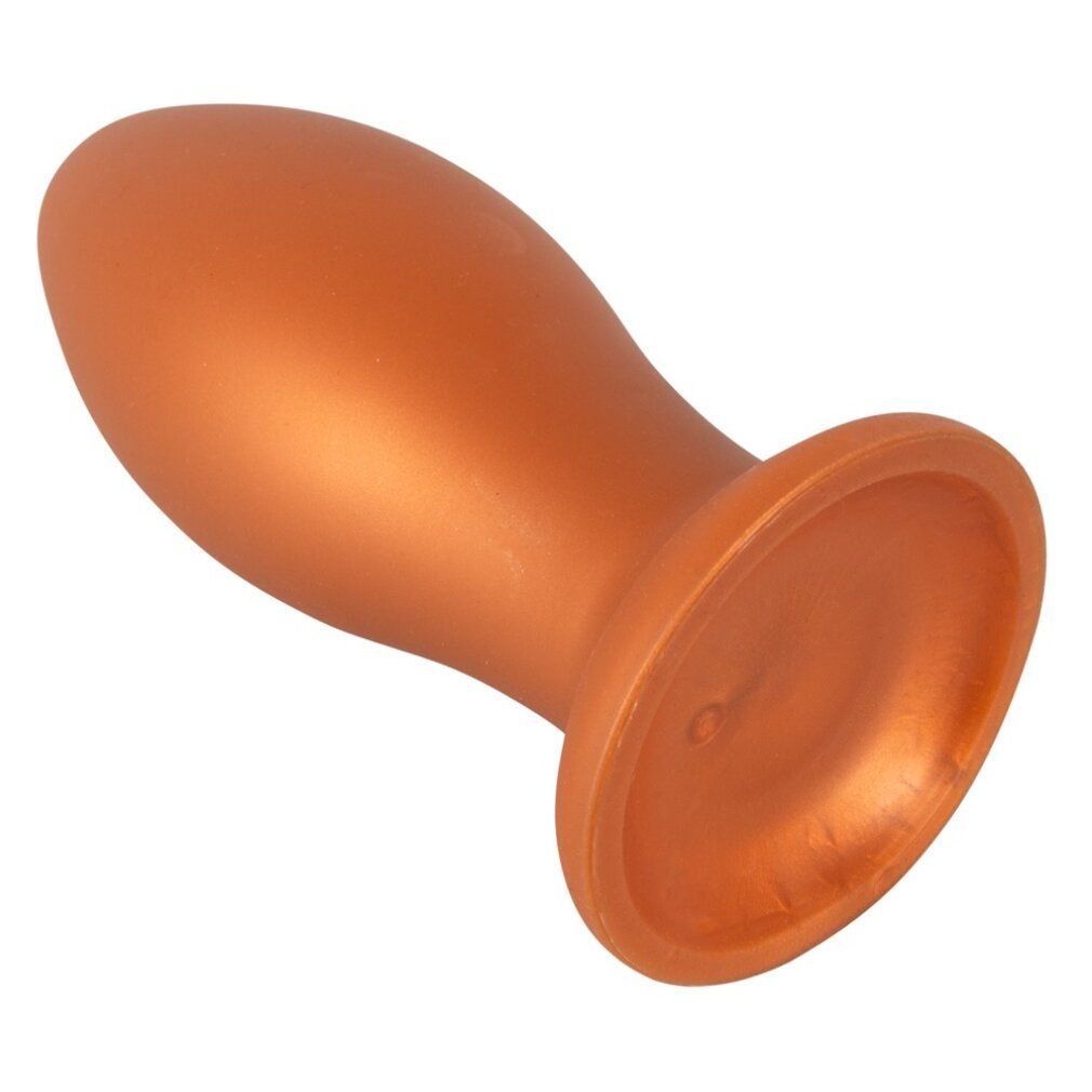 Orangefarbener, weicher Butt Plug mit Saugnapf. Runde Basis, konische Form. Glatte Oberfläche.