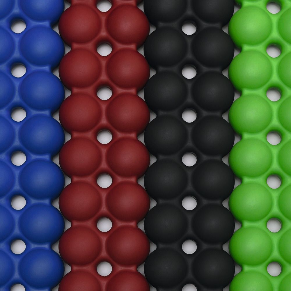 Nahaufnahme von Spinefitter-Rückentrainern in Blau, Rot, Schwarz und Grün. Die Oberfläche besteht aus runden Elementen.