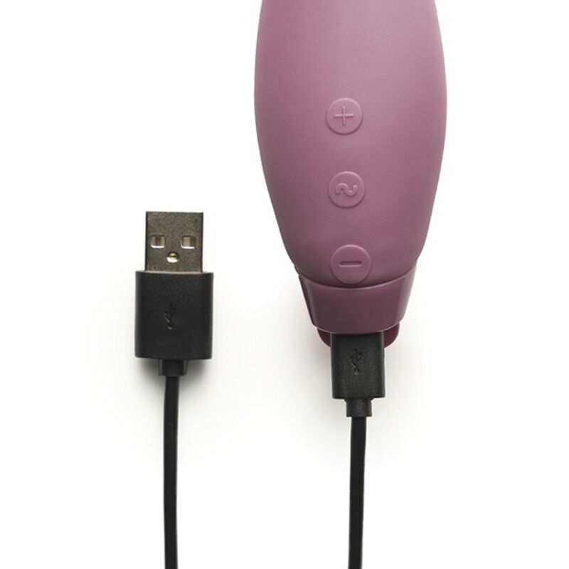 Nahaufnahme: Vibrator mit USB-Ladekabel. Lila, mit Knöpfen. Schwarzes Kabel.