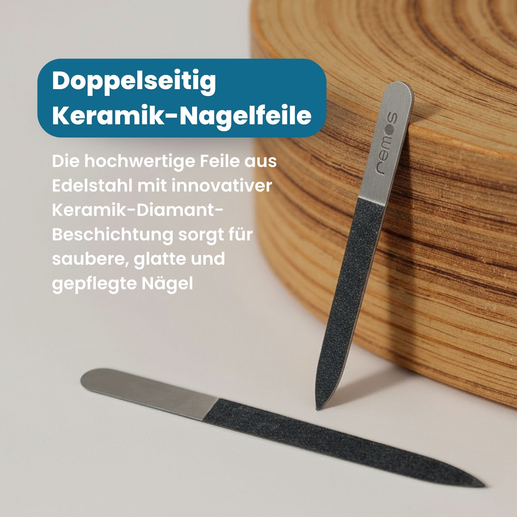 Zwei Edelstahl-Nagelfeilen mit Diamant-Keramik-Beschichtung auf einem Holzobjekt.